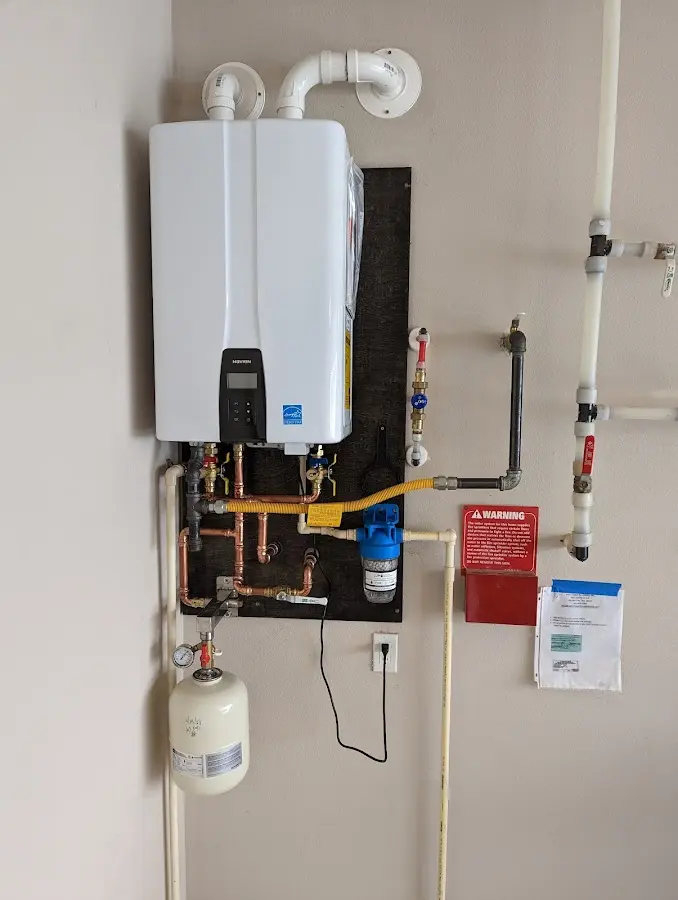 Professional plumber installing copper piping in a Gainesville home